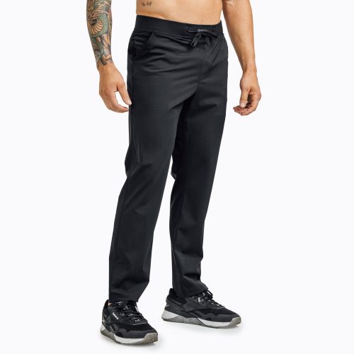 Front view of model wearing the black REP Felix Pants.