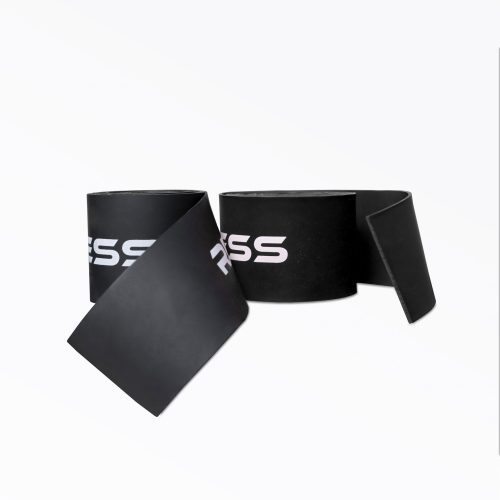 A pair of rolled up black REP Floss Bands.