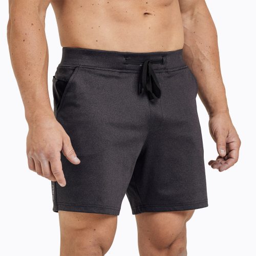 Front view of model wearing the heather black REP Versa Shorts.